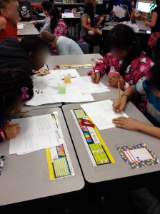 Students working together, each with a different responsibility for this science experiment.  