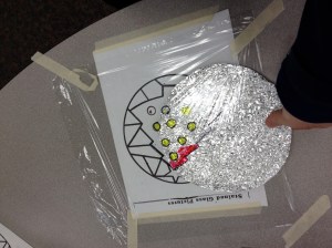 *Important- to wrap the file folder in foil, you must first crumble it into a ball and then gently unwrap it.  Be careful because it tears easily.  This is what gives the window the desired look. 